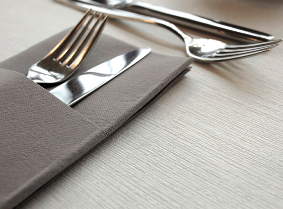 Napkin pocket preloaded with cutlery on a restaurant table