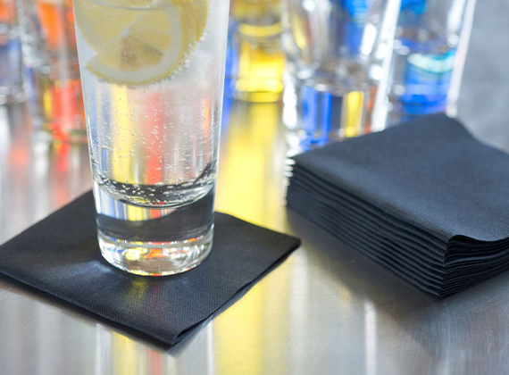 Sustainable cocktail napkins used for drinks on a bar