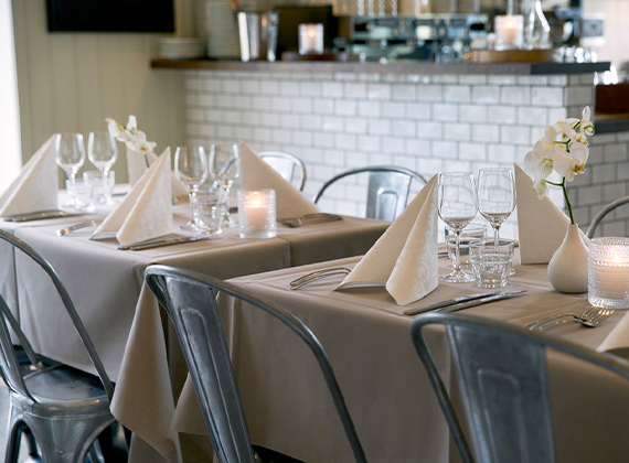 Grey Evolin® table cover on a set restaurant table with white napkins