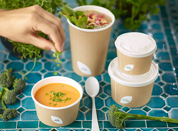Takeaway soup bowls stacked on a table