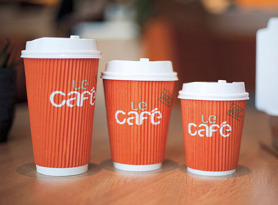 Range of branded takeaway coffee cups in different sizes